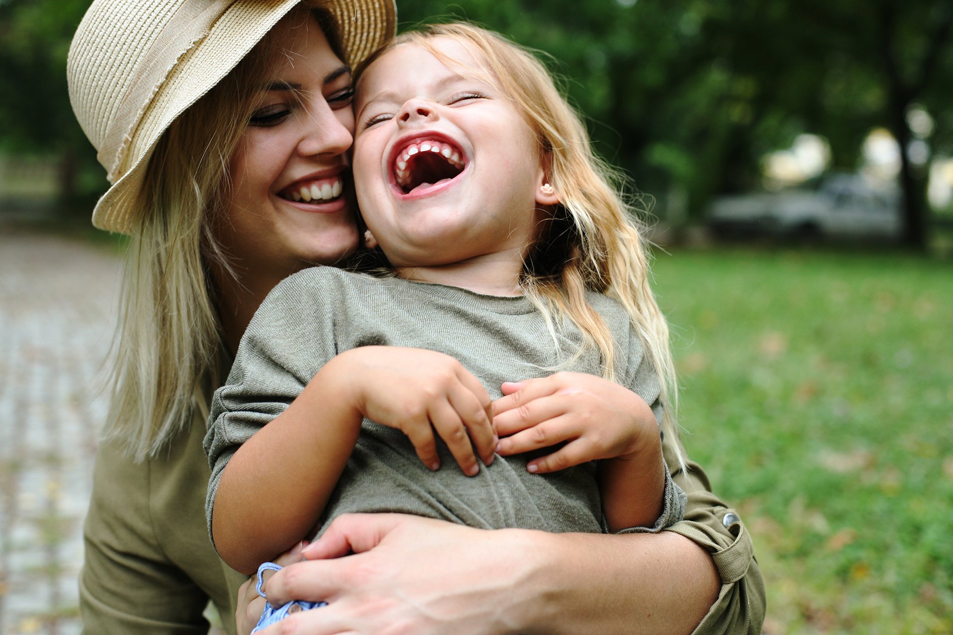 happy parents and child who have a family dentist in Logan UT